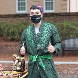 student on greene street in traditional dress