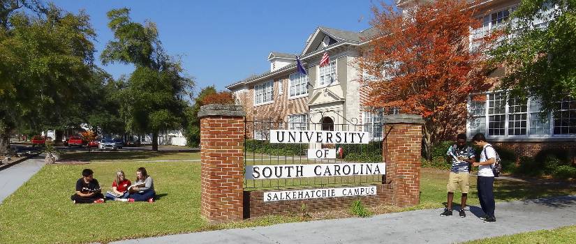 Students relax next to Spruce Hall on the USC Salkehatchie Allendale campus.