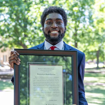 Portrait of Sullivan Award winner Tremayne Ansani