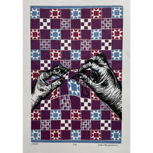 Image of two hands sewing a quilt