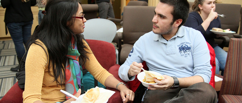 two people conversing over food