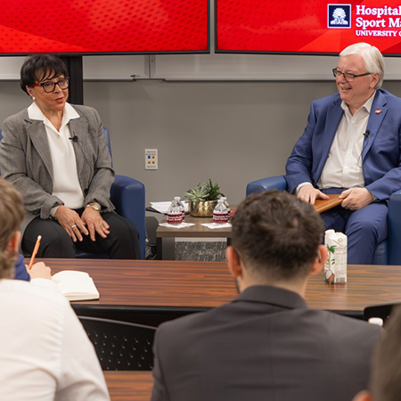 Sheila Johnson and Michael Amiridis speak to a class