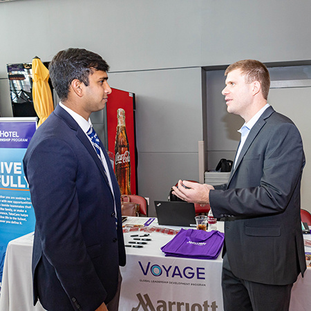 A company representative speaks to a student at Experience Expo. A company representative speaks to a student at Experience Expo.