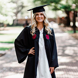 Emily Ruble Emily Ruble poses in her cap and gown on the USC Historic Horseshoe.