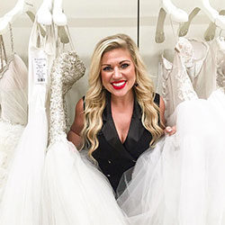 Hunter Bailey Hunter Bailey stands surrounded by wedding gowns at Kleinfeld Bridal in NYC