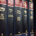 Photograph of 5 SC Code books on shelf.
