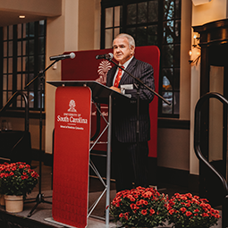 Dean Harmon speaking at a lecture