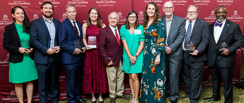 A group photo of award winners from the 2025 ceremony