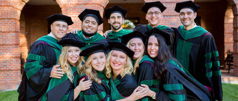Students celebrating together after graduation ceremony