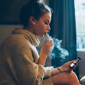 Teen using e-cigarette