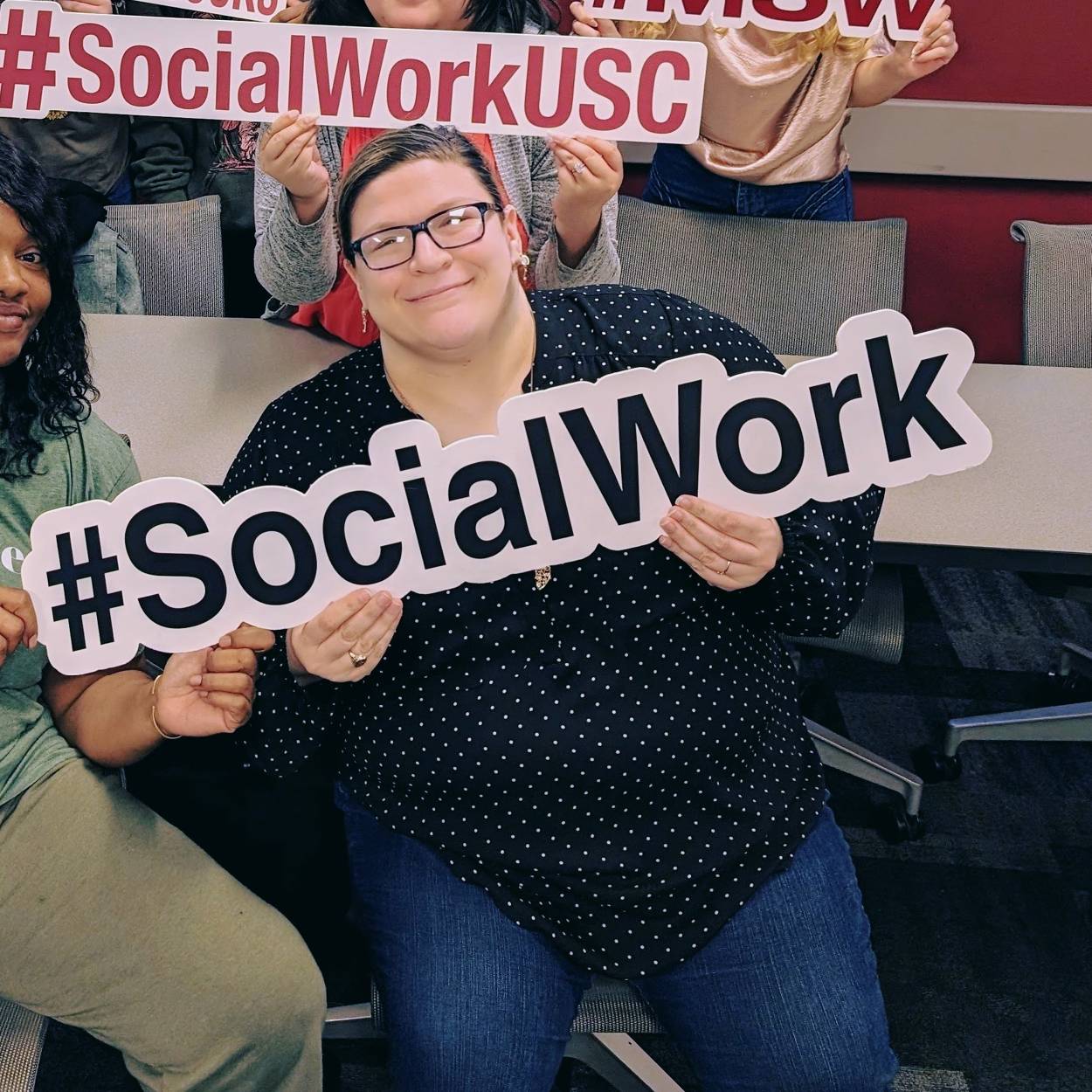 salmons holding a sign